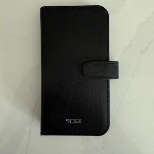 Tumi iPhone 14 Pro black leather wallet case.